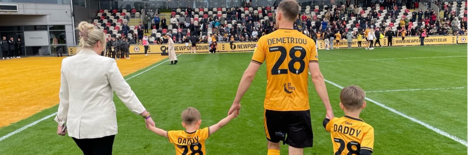 Mickey Demetriou banner