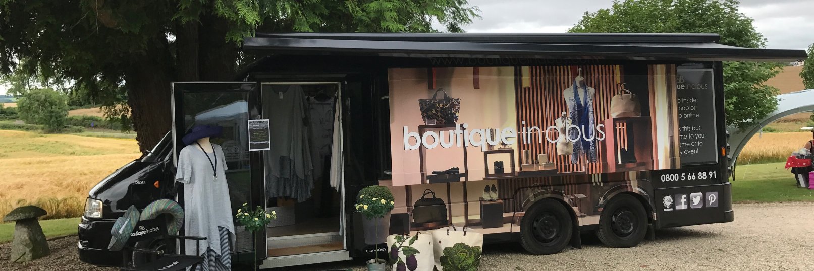 Boutique in a bus banner