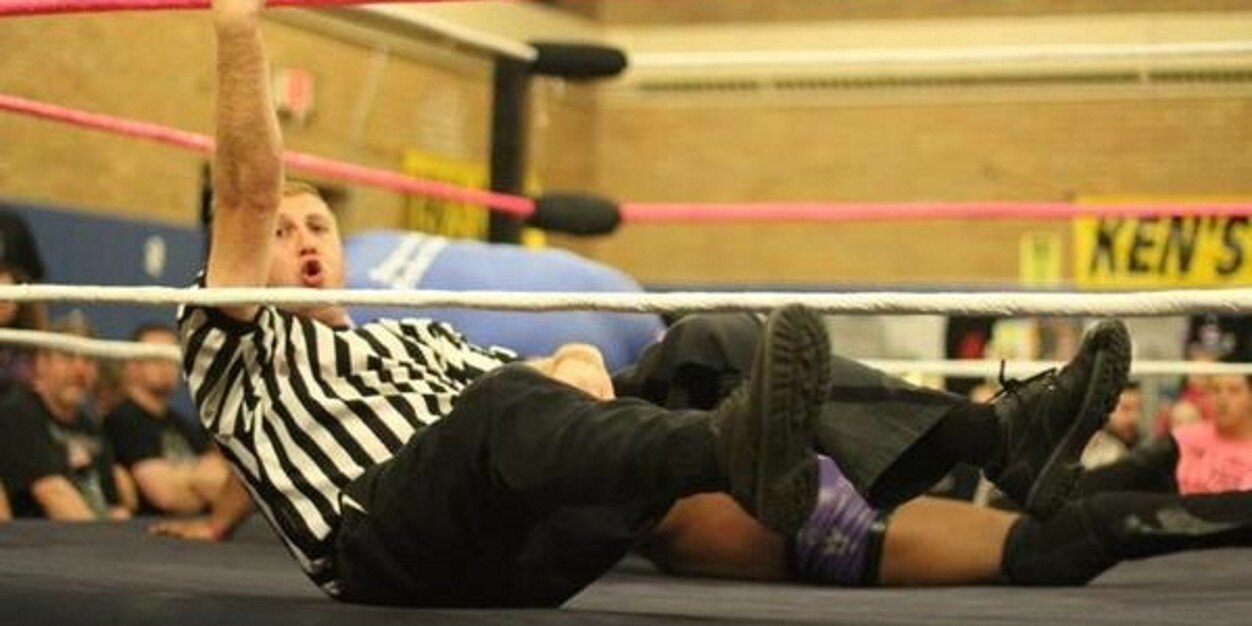 Referee Vinnie Lax banner
