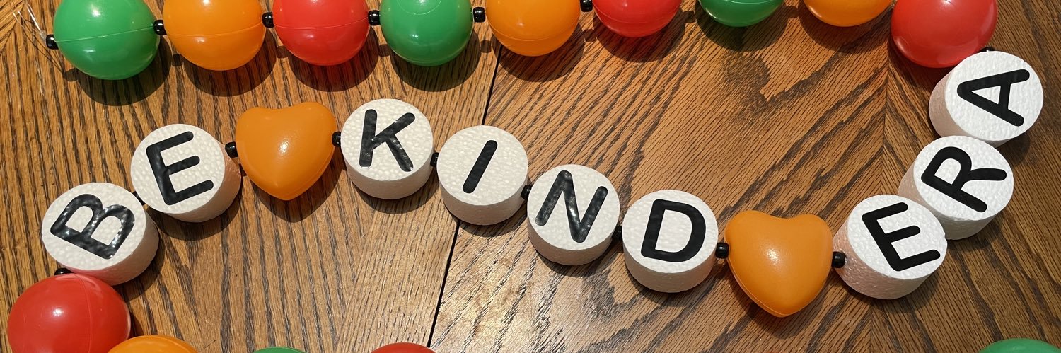 Caryn with her wine banner