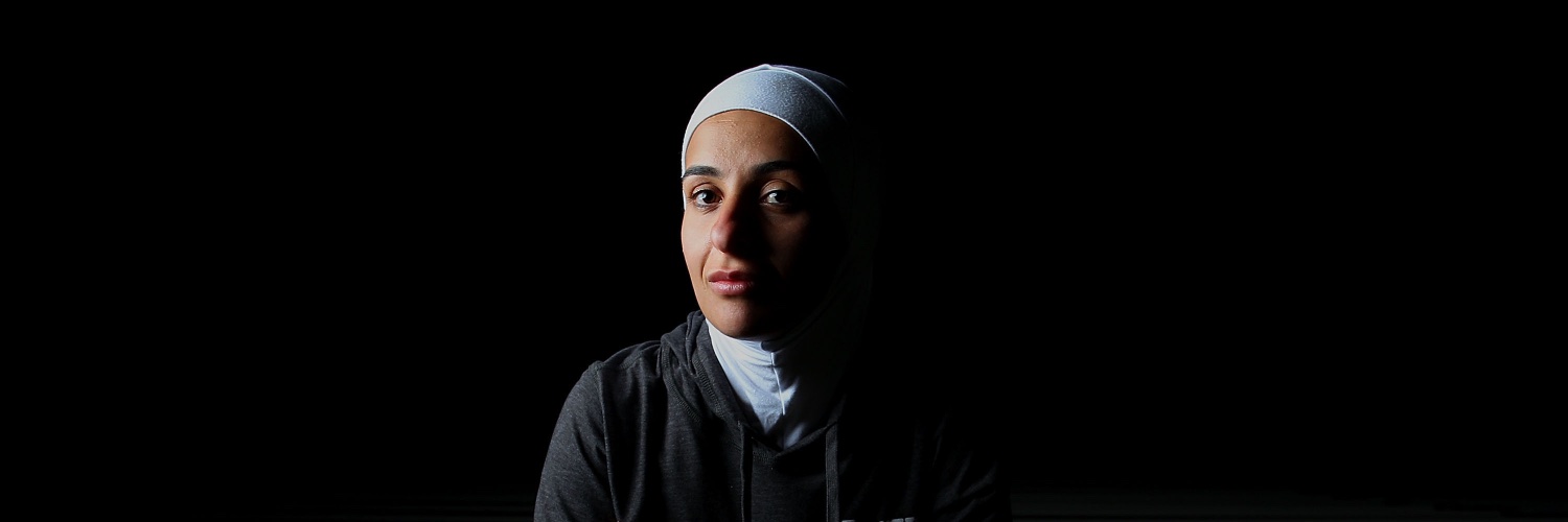 Amna K-Hassan banner