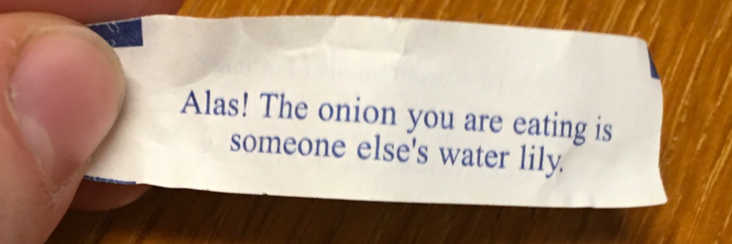 bowl full of olives next to the toilet banner