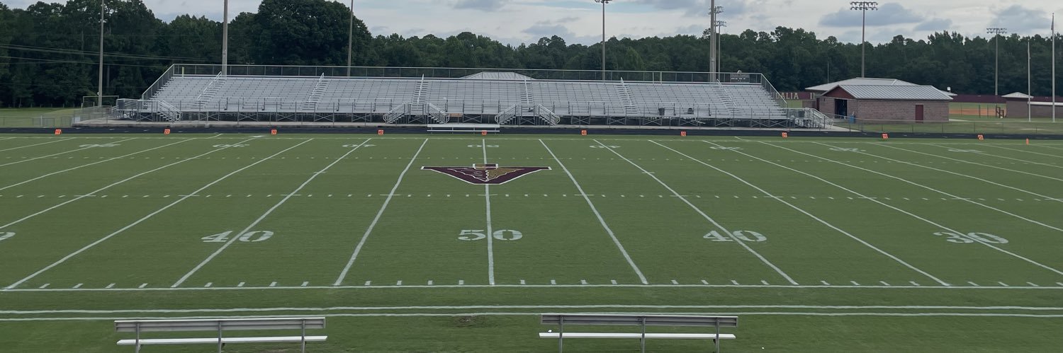 Coach Travis Blewett banner