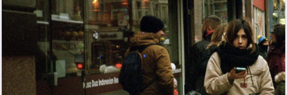 in parentheses banner