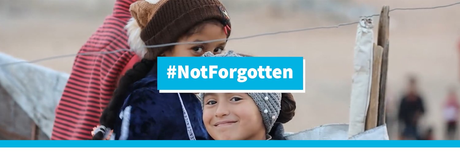 UN in Syria's banner