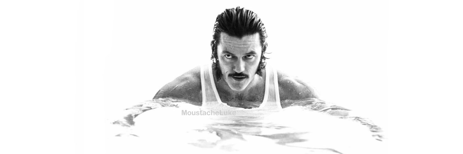 Luke Evans moustache banner