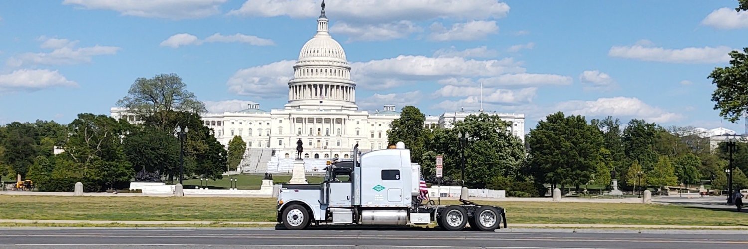 Trucking Across America with the Schmitts's banner