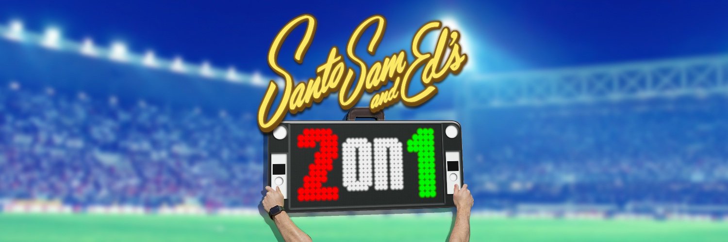 Santo Sam and Ed's 2 on 1 banner