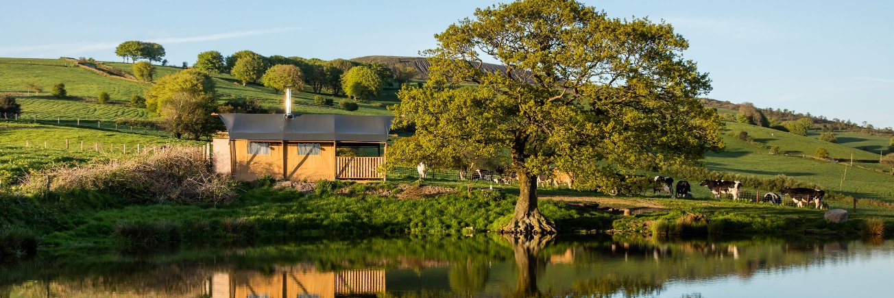 Under the Oak Glamping banner