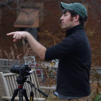 A cold-blooded vertebrate animal of a class that comprises the frogs, toads, newts, and salamanders. Computer programmer and filmmaker.