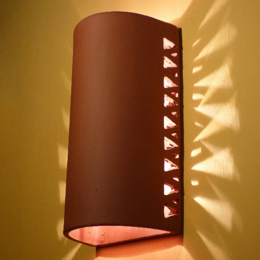 Architectural ceramic number tiles, sconces, murals by hand in Austin, Texas.