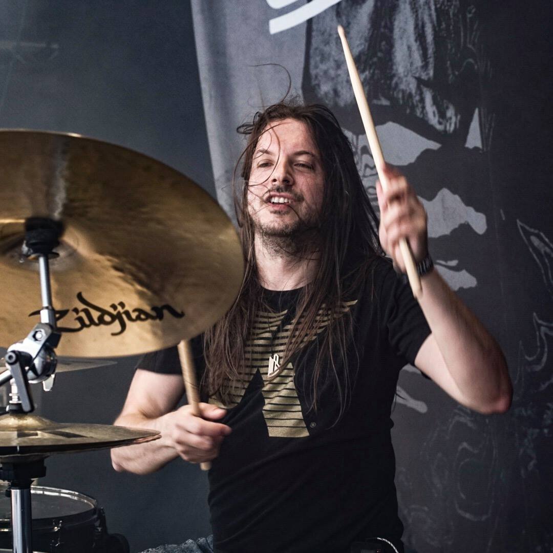 Drummer for CyHra and Kamelot, proudly endorses Mapex Drums, Zildjian Cymbals and Sticks, Remo Heads, 2box Electronics