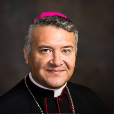 “Caritas Dei difussa est in cordibus nostris”.                       Titular Bishop of Cataquas, Auxiliary of Brownsville, Texas