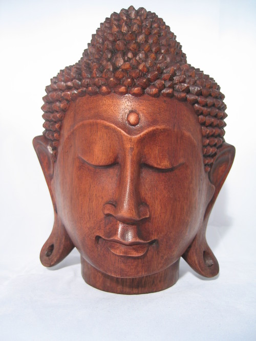 Seller of  Balinese hand carved Buddha masks and figurines.