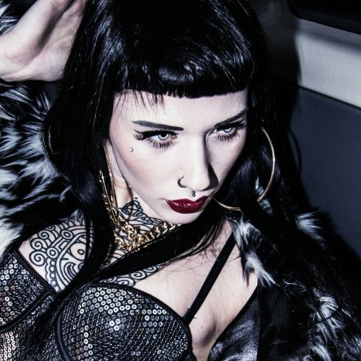 VexingMaledict's profile picture. A woman like me has a sword for a tongue, night in the heart, and fire in her soul. @FangedSovereign is the only one who stokes my flames.