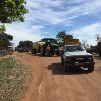 Mixed family farming in Southern NSW, Contract Hay/Silage making - Massey SP mower, rotary rakes, 8 String Krone Baler and a 6 bale stacker.