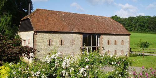 A stunning rustic barn wedding venue situated a short distance from the attractive villages of Wisborough Green and Kirdford, in West Sussex.