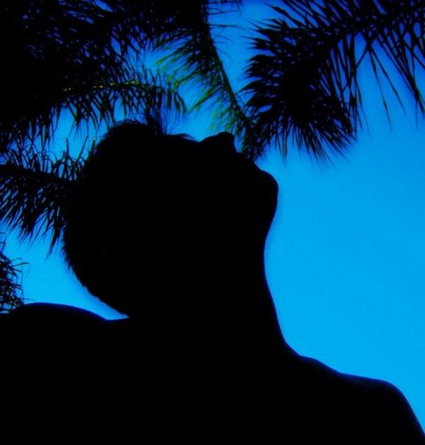 I'm a black silhouette living in a blue world.