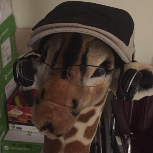 Bespectacled Canadian Giraffe. Goblins are real. Be Aware. Be Goblin Safe. He/Him