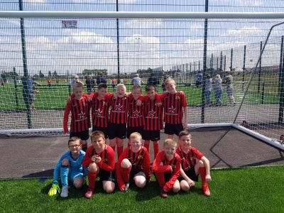 u10s football team playing in the hightown league.