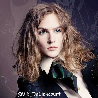 Vik_deLioncourt's profile picture. ~Blond long hair, curls like an angel and blue eyes, yes that's me Viktor, the son of @Gentleman_Death ~ •#VC  RP+21 #SV #Single and looking. /Vampire/ #Pʀɪɴᴄᴇ•