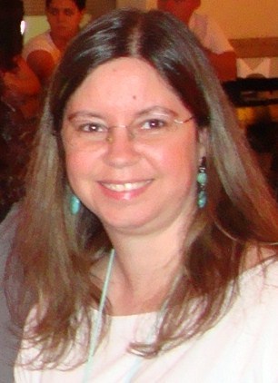 an English teacher who loves books, cooking and adores dogs.