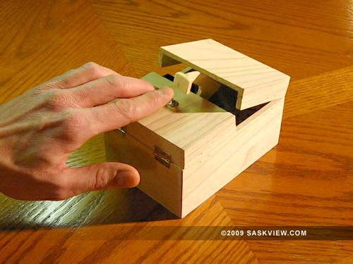 I built that machine and made that useless video! You can build one too: parts kits, instructions and more can be found at my web site.