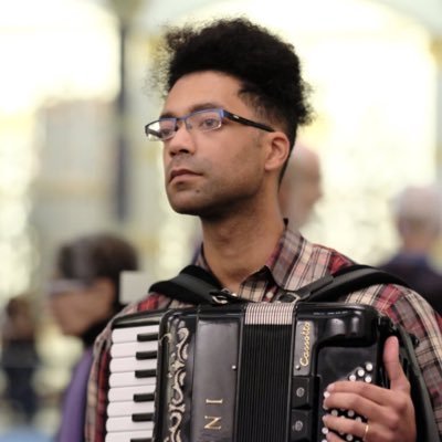 Composer, accordionist, vocalist, a walking case study of imposter syndrome. He/him.