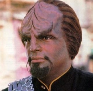Lieutenant Commander Worf of the USS Enterprise-D. I am a Klingon. If you mess with my captain, you mess with me. Are we clear?