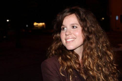 Lauren sings and plays baby-sized, missin'strings guitars and wrist tambourines. She likes long walks off short piers, and Yahtzee.