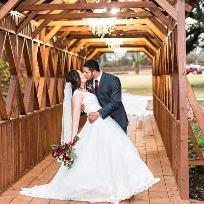 The Barn at Lacey Farms is a beautiful barn wedding venue with a unique layout of old and new barns, trees and covered bridge.