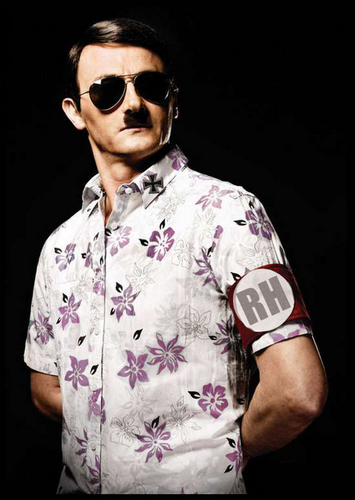 Check out my slick moustache. You may recognise my grandfather from TV such as The History Channel. He loved a parade! My friends call me That Randy Bastard.