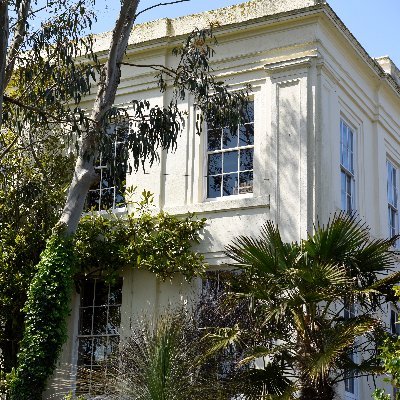 An independent library established in 1818 with 70K+ books, archives, and historic photographs housed on floor-to-ceiling shelves.