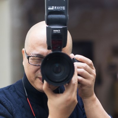 A man pressing the shutter from Anhui, China