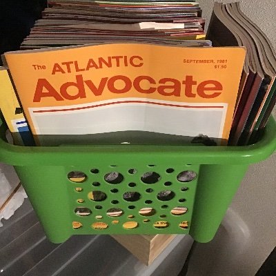 A stylish man on an uptown pier, who stumbled upon old issues of the Atlantic Advocate. Posting their contents without irony