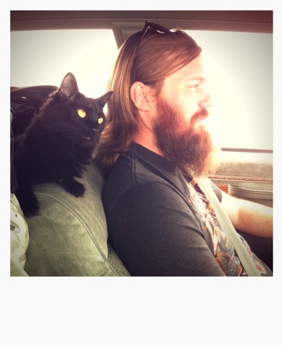 A blog with pictures of dudes with sweet beards holding cats.