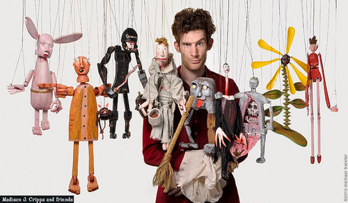 Madison J. Cripps makes and brings his unique wooden marionettes to life with song, improvised interaction and pun. Madison composts in his backyard.