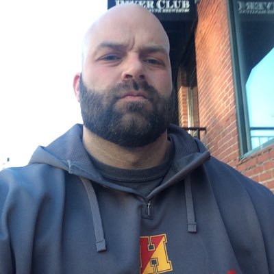 bigmattwallace's profile picture. bald with a "powerful" build...