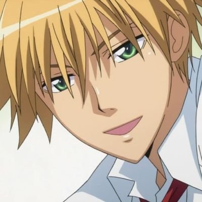 Usui, a blonde anime character is looking forward with a smile on his face.