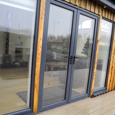 The Double Glazing Shop supply double glazed aluminium & UPVC windows and doors to the public and trade. Bi-folding doors, Solidor composite doors and Veka UPVC