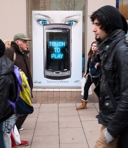 Street photography in the North of England - the capturing of a decisive moment in a public place within the context of the environment of the subject.