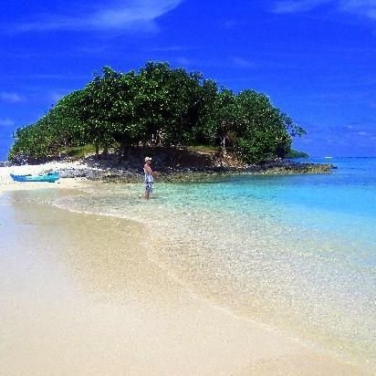 Fishing in Paradise with a beer in one hand.