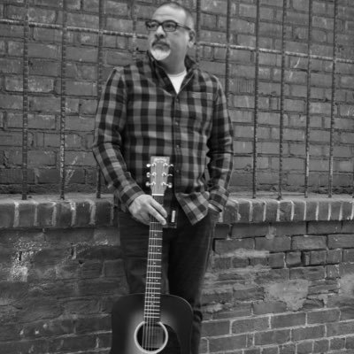 Just a guy who loves to sing and play guitar available for hire at your restaurant or brewery!