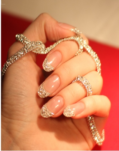 The Iced Manicure- The first and best! A bespoke service adorning our clientelle with 10 carats of diamonds at their fingertips!