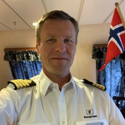 Norwegian, Captain, enjoying wine and seafood,