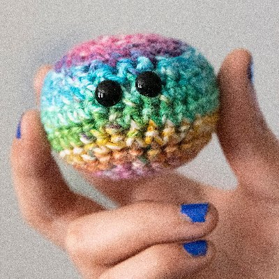 Crocheted emotional support orbs spreading love, healing and kindness