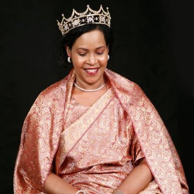 Her Royal Majesty Queen Dr. Best Olimi Kemigisa Akiiki the mother to King Oyo Nyimba Kabamba Iguru Rukidi IV and Princess Ruth Nsemere Komuntale.