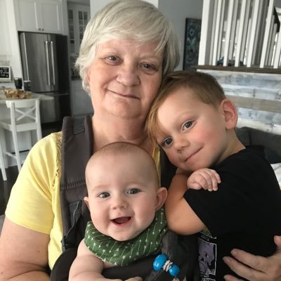Nana with 2 grandson. Two children a girl and boy. Retired
