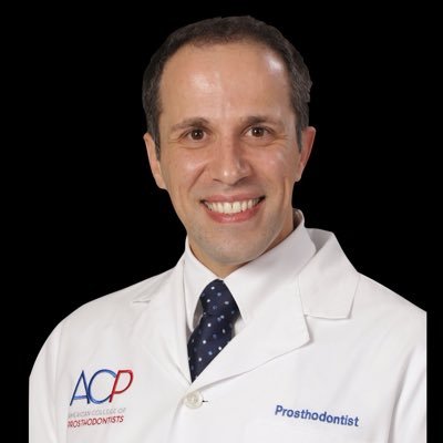 Amir Koujan DMD, MS, PhD.  German Board of Implantology American Board of Dentistry, American Board of Prosthodontics, American Board of Cosmetic Dentistry.