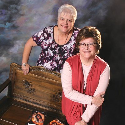 We're Leigh Neely and Jan Powell, aka Neely Powell. Our paranormal romance series, The Witches of New Mourne, follows a coven battling evil and a deadly curse.